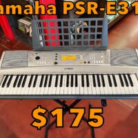 Yamaha PSR-E313 keyboard w/sheet music stand - $175
