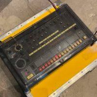 1981 Roland TR-808 drum machine w/cover, dust cover & flight case - $6,700